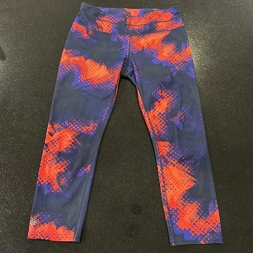 ATHLETA 3/4 Leggings in Red/Purple Pattern with Back zipper pouch Size Small